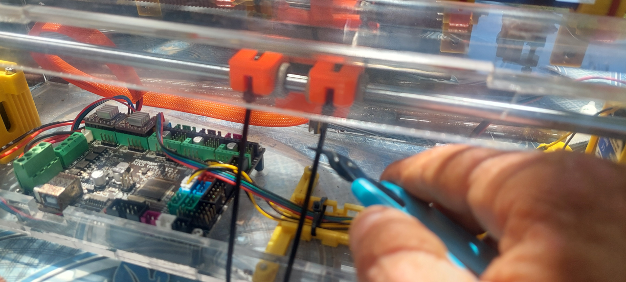 Cutting the zip tie extra length with a plier