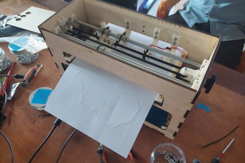 A BrailleRAP embosses a map of Africa.