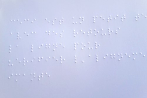 A section of a page where Braille characters can be seen.