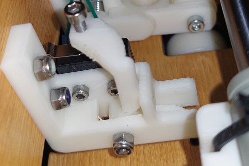 We can see the paper position detection limit switch with the 3D printed lever.