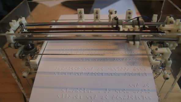 A BrailleRAP embossing a Braille page.