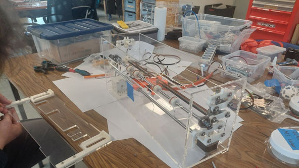 A BrailleRAP XL being assembled on a table.