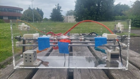 A BrailleRAP XL placed on a table outside.