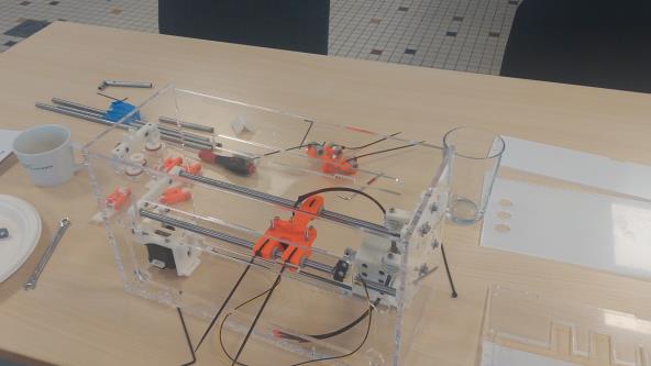 A BrailleRAP being assembled placed on a table.