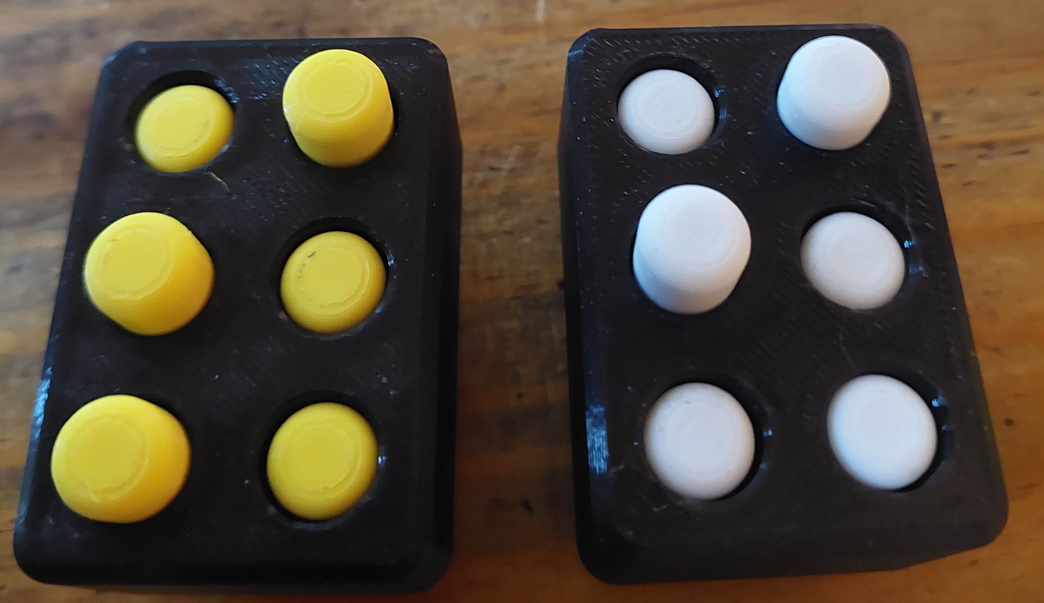 The Peg Cell, a small 3d printed object on which you can display Braille characters with 6 dots